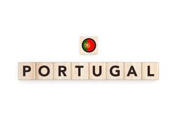 Wooden blocks bearing the name and flag of Portugal. Portuguese, Atlantic and European Culture, national identity, travel, and geography in a copy space design.