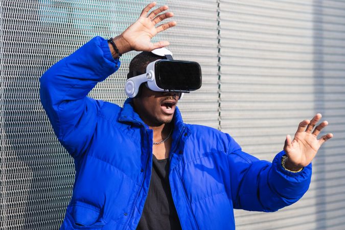 Black man experiencing virtual reality in city