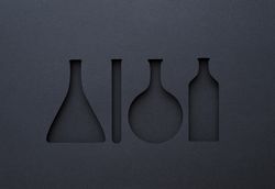 Silhouette cut outs of chemistry tools with paper