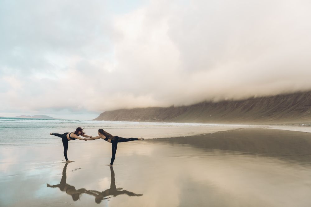 Women exercising near sea