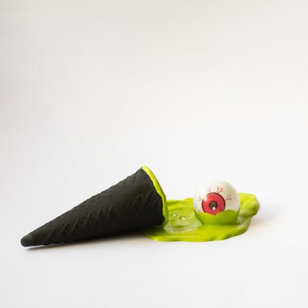 Green ice cream with eye ball in halloween concept