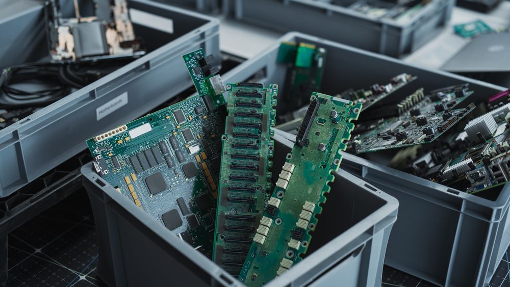 Close-Up Shot Of Boxes With Computer Parts Sorted For Recycling At Sustainable Electronics Factory.