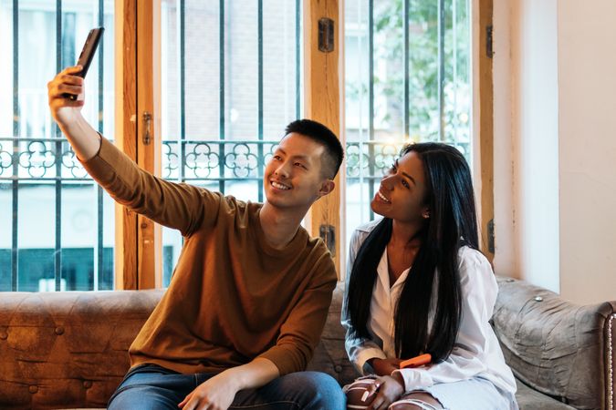 Asian man and Black Latina woman on a date