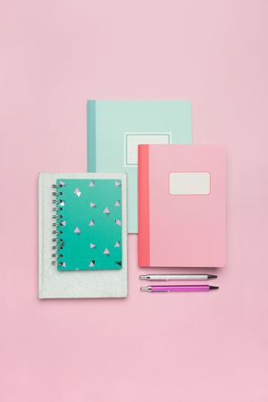 School stationery set on pink background