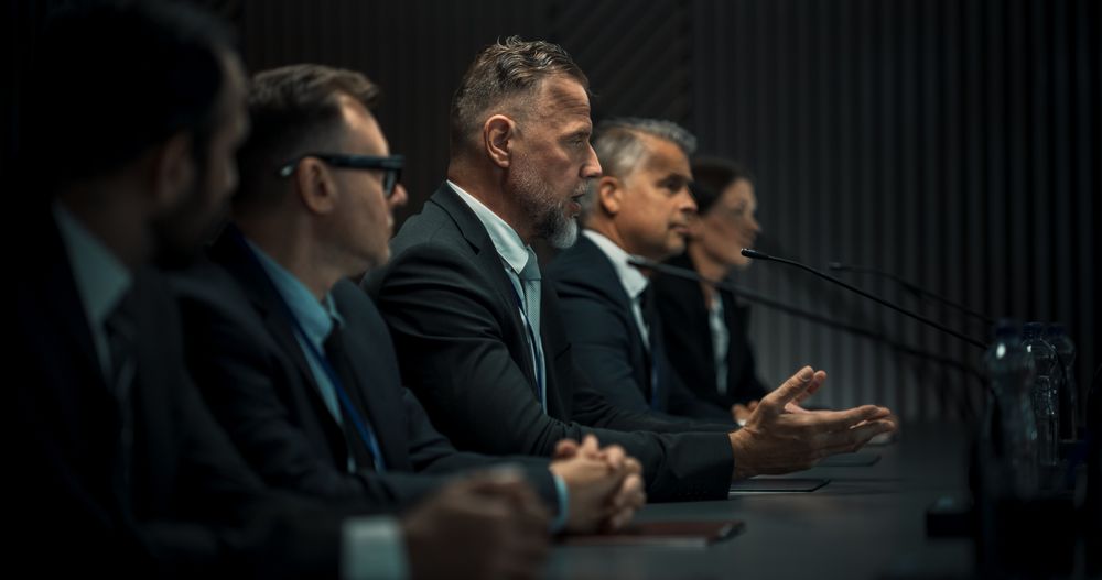 Male Head Of Political Delegation Speaking At an International Ecology Forum Press Conference.