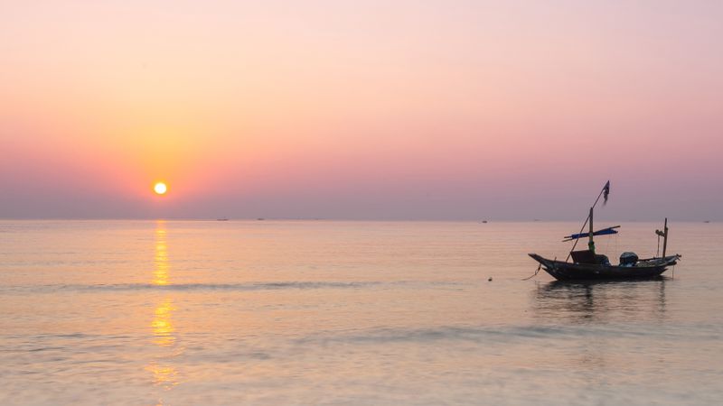 Moody Sunrise On The Beach