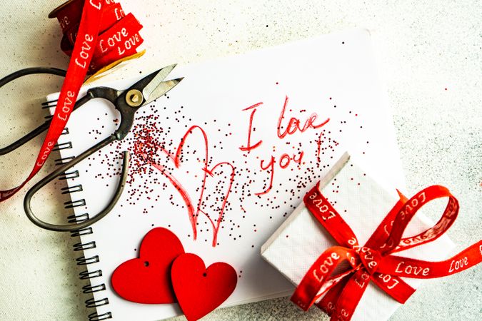 Valentine Day holiday concept with "I love you" written on paper with giftbox