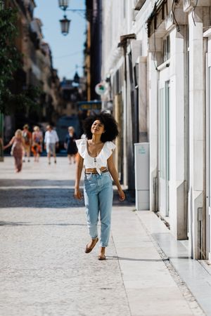 Young female walking down street