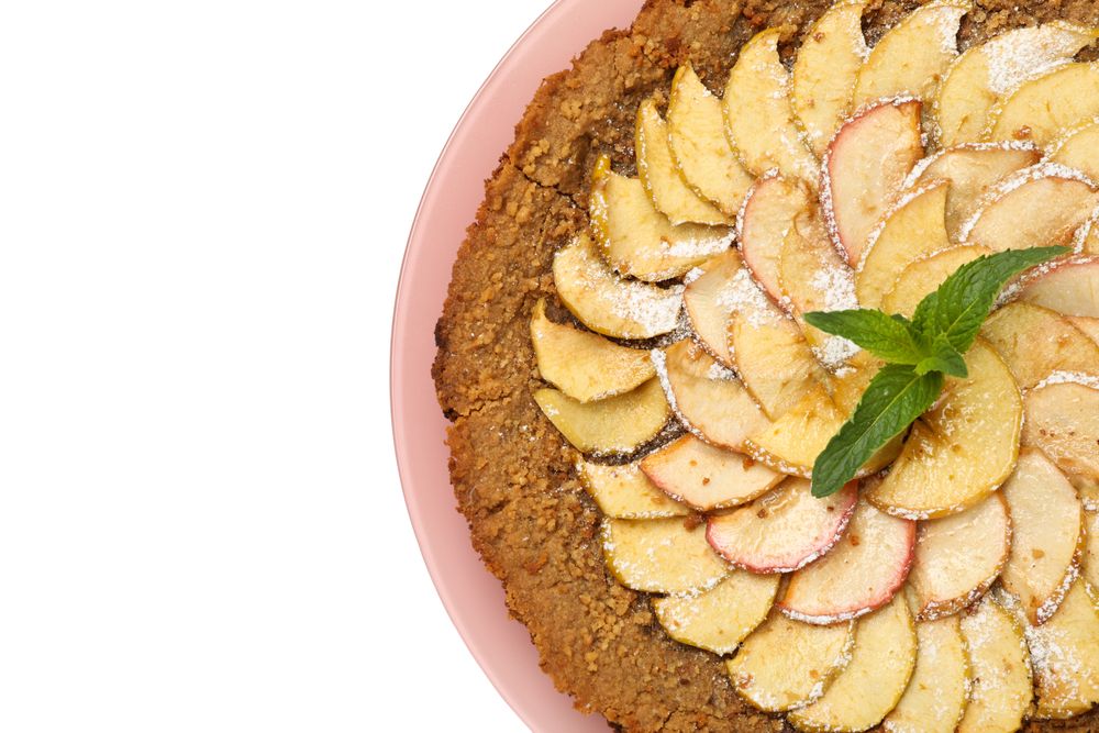 Plate with tasty apple pie isolated on plain background
