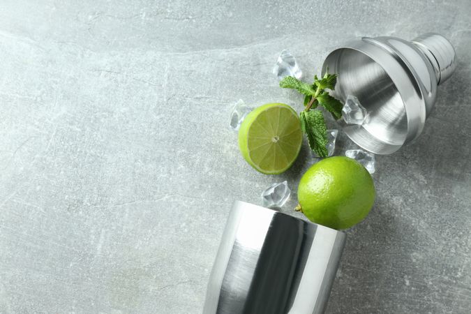 Concept of preparing cocktail, shaker, space for text