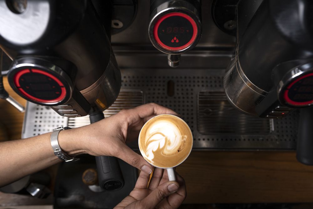 Barista using coffee machine