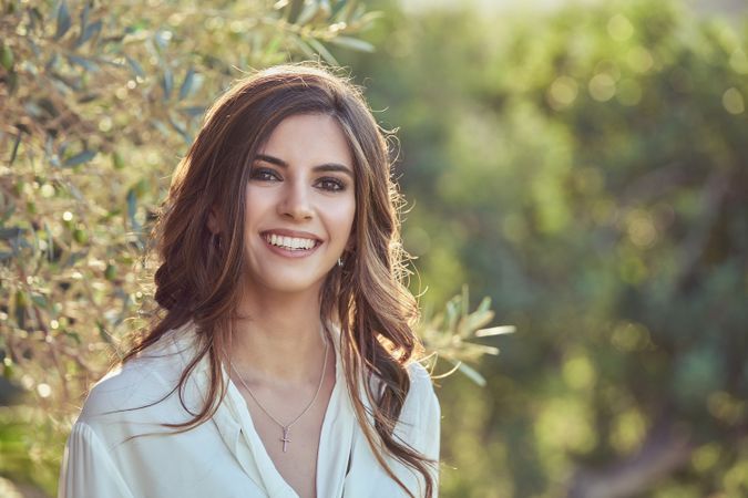 Smiling woman standing in nature