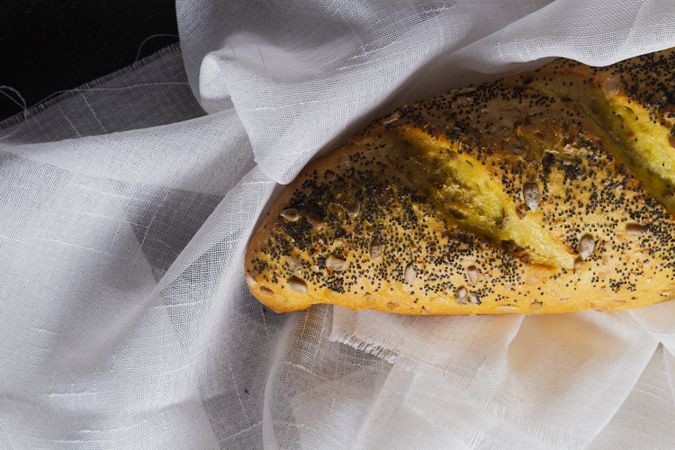 Loaf of bread with grains and poppy seeds
