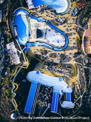 Aerial shot of a blue and yellow resort with water slides 5wmEyb
