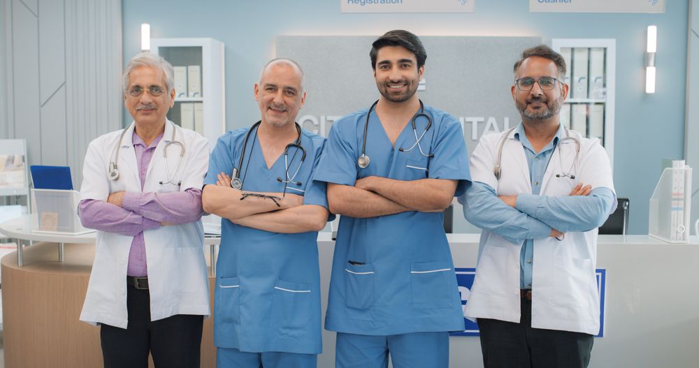 Portrait of a Group of Male Indian Doctors in a Hospital Smiling and Looking at the Camera.