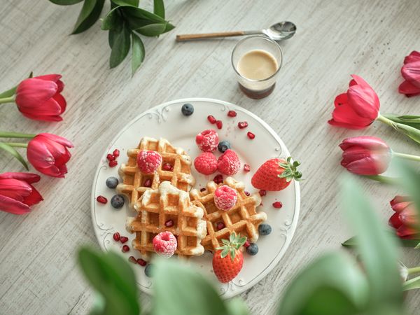 Waffles near inscription and coffee