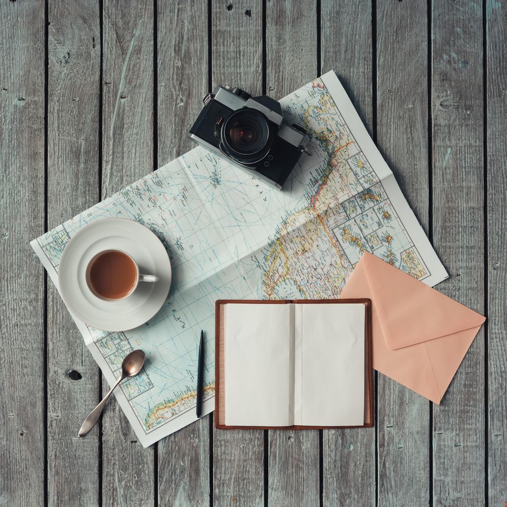 Open map on wooden background
