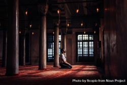 Man kneeling inside Mosque praying 5XWmo0