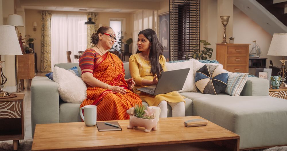 Mother and Daughter Using Laptop: Bonding Over Online Shopping