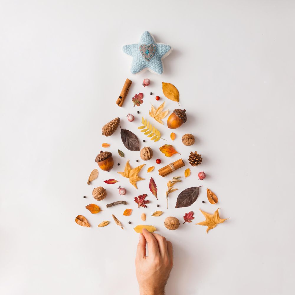 Christmas tree made of various autumn leaves and fruits
