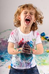 Excited dirty boy screaming in studio