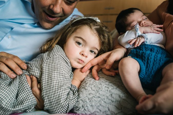 Happy family having fun in bedroom