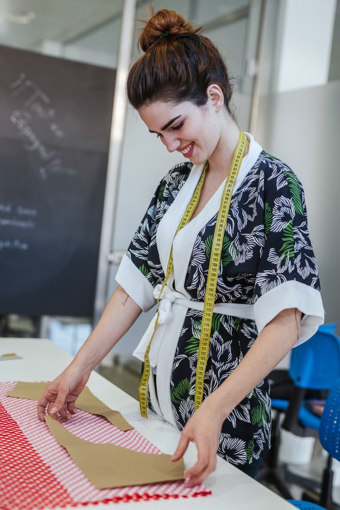 Woman in a sewing school