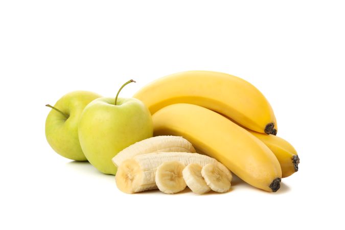 Bananas and apple isolated on neutral background. Fresh fruits