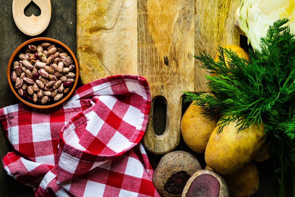 Pinto beans, potatoes and dill on kitchen counter