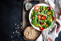 Top view of bowl of vegetable salad with garbanzo beans