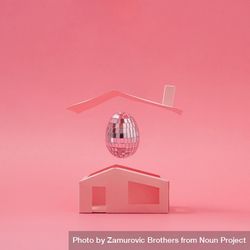 Pink disco ball Easter egg above minimalistic house 4NMA85