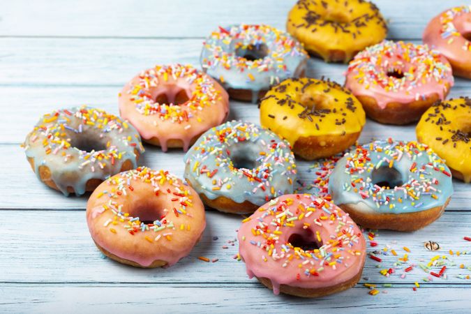 Delicious assorted colorful donuts on the table.