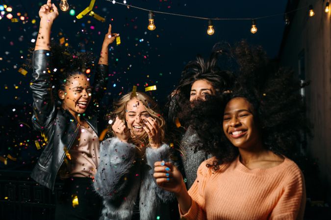Multi-ethnic group of women having fun at a party outside