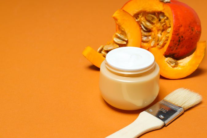 Skin care and face care concept - pumpkin cosmetic