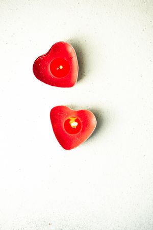 St. Valentine's day card concept with two heart shape candles