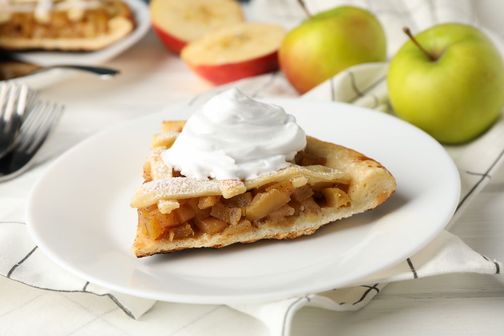 Composition with apple pie on wooden background. Tasty lunch. Homemade breakfast