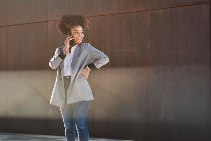 Black woman having phone conversation on street