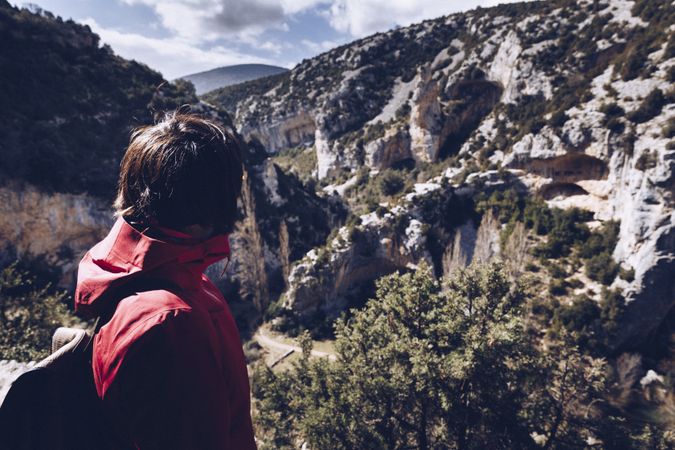 Person looking at picturesque view of canyon between mountains