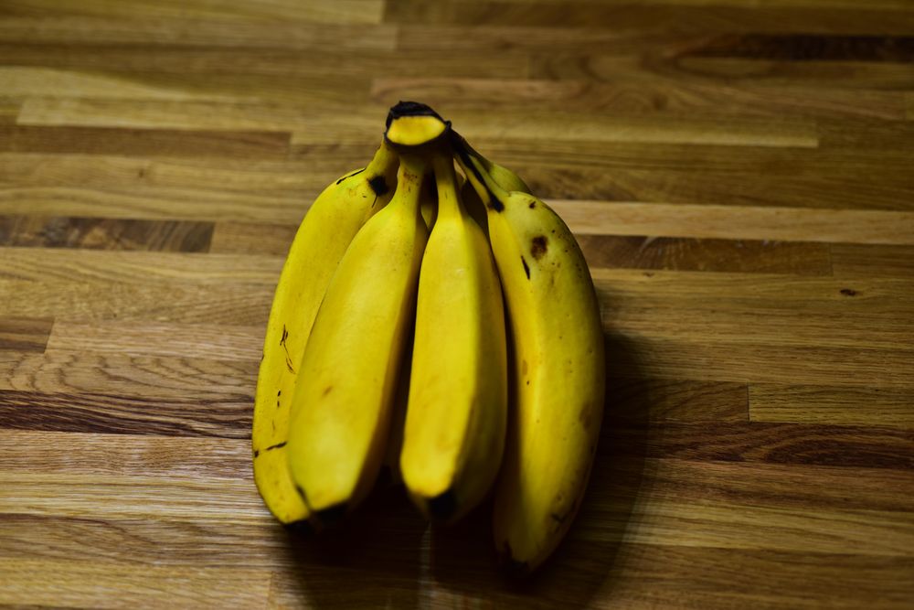 Yellow banana on a wooden table.