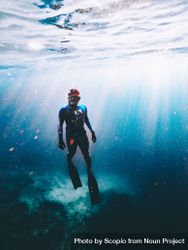Underwater photography of man diving 5oBM90