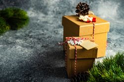 Two Christmas presents wrapped with decorative snowflakes