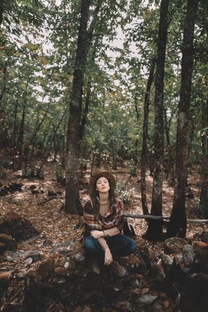 Young woman relaxing in forest