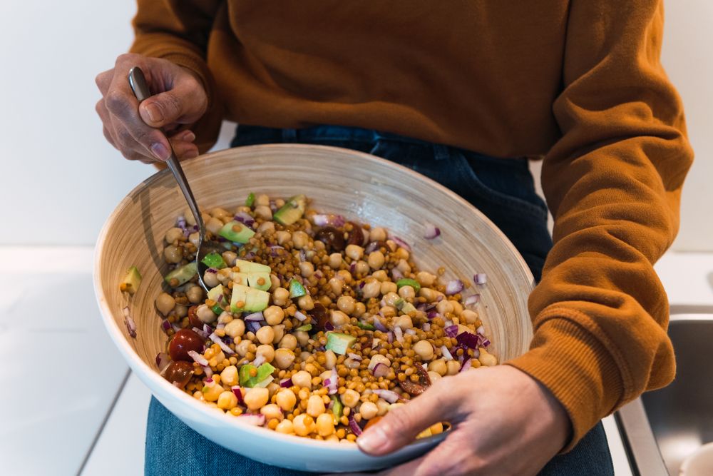 Black woman eating healthy salad