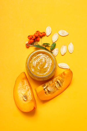 Skin care and face care concept - pumpkin cosmetic