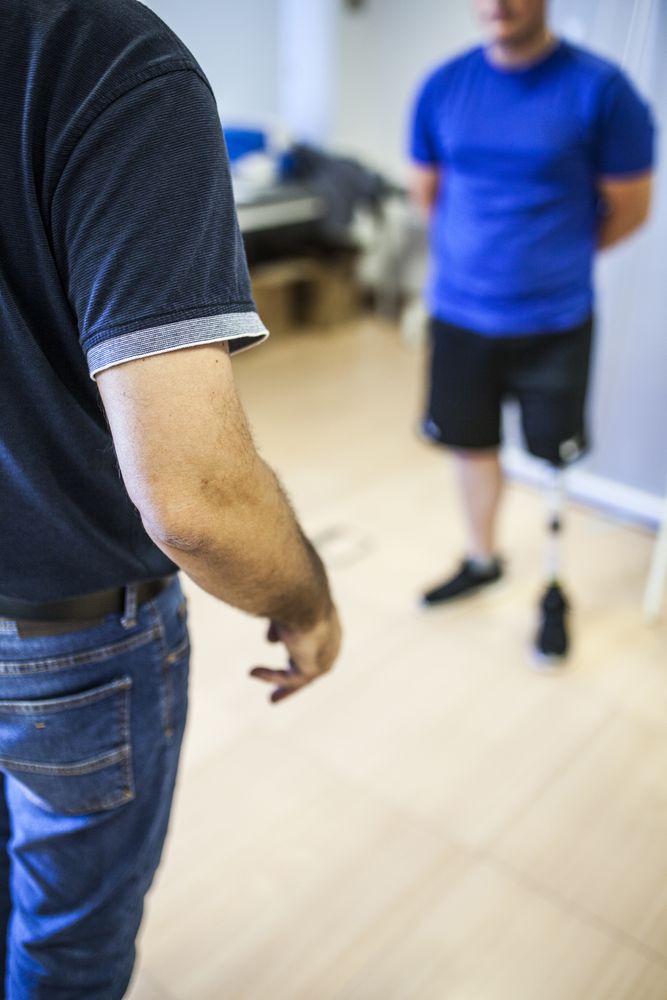 amputated young man testing the new leg prosthesis