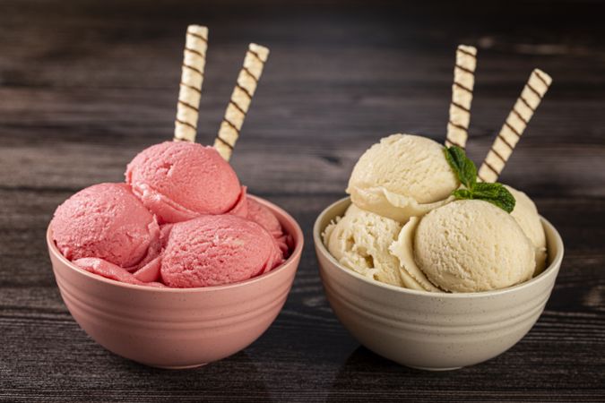 Bowls with strawberry and vanilla ice cream.