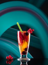 Glass with drink and berries
