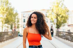 stylish woman with curly hair portrait