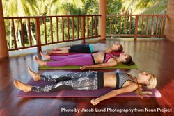 Shot of yoga class with women lying on floor 4m3VQ0