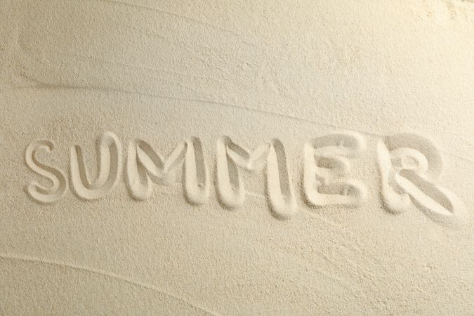 Clear sea sand with inscription summer, space for text and top view. Summer vacation background